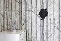 Detail of wolf head on grey woodland themed wallpaper 