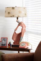 Vintage lamp and telephone on side table 