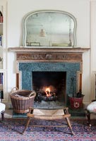 Lit fireplace in country living room 