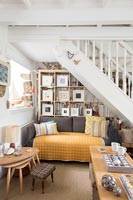 Small cottage living room with staircase 