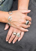 Woman's hands with silver jewellery 