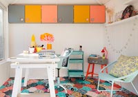 Colourful workshop with storage and desk 