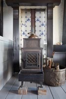 Dutch tiles in fireplace with wood burner 