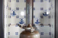 Classic blue and white Dutch tiling in C16th Dutch Windmill fireplace  