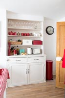 Dresser in red and white kitchen diner 