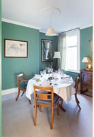 Classic dining room wit teal painted walls 