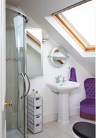 Purple chair in modern bathroom 