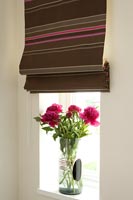 Roman blinds and flower arrangement 