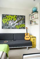 Colourful artwork on kids bedroom wall 