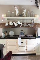 Large aga in fireplace of country kitchen 