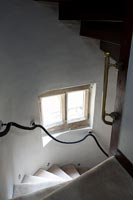 View from landing to staircase with rope hand rail 