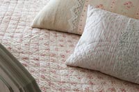Floral cushions and bedspread 