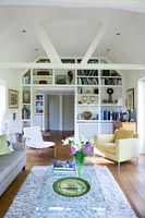 Contemporary living room with built in bookcases around doorway 