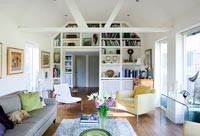 Modern living room with built in bookshelves around doorway 