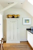 White cupboard in modern kitchen-diner 