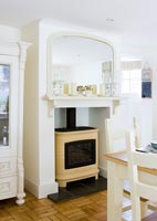 Wood burning stove in country dining room 