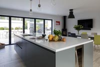 Modern kitchen with large island and dining table