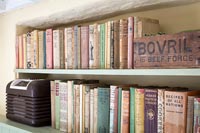 Bookcase with old books and vintage items 