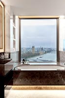 Modern bathroom with views to Houses of Parliament on River Thames 