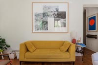 Mustard coloured sofa in modern living room 