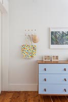 Blue chest of drawers in childrens room 