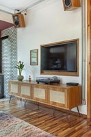 Wooden sideboard in modern industrial living room 