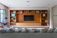 Contemporary living room with large shelving unit 