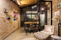 Exposed brickwork in small open plan apartment 