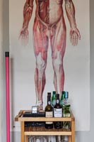 Drinks cabinet with artwork behind
