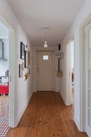 White painted corridor with wooden floor 