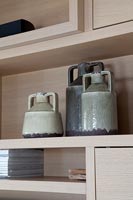 Ceramics on modern wooden shelf 