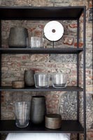 Modern shelves displaying pots and glasses