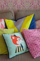 Colourful cushions on sofa 