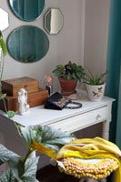 Houseplants on classic dressing table 