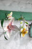 Decorative metal flowers on old coat hooks 