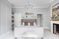 Modern bedroom with large upholstered bed