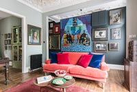 Colourful artwork and furniture in modern living room 