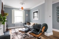 Grey painted living room with retro furniture 