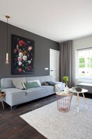 Modern living room with grey walls 