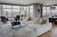 Modern living room with white corner sofa