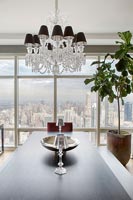 Modern chandelier over dining table