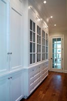 White cabinets in the hallway