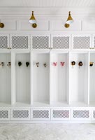 White built-in cabinet with toys for coat hooks