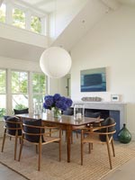 Modern dining room with vintage table and chairs 