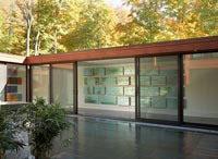 Modern glass summer house with patio 