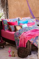 Outdoor bed with soft furnishings 