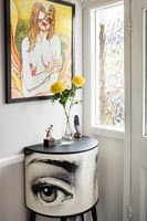 Quirky console table and painting in hallway 