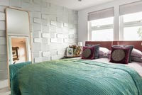 Modern bedroom with textured feature wall 