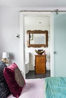 View through open bedroom door to en-suite bathroom 