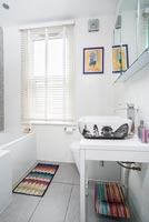 Sink decorated with iconic London buildings in modern bathroom 